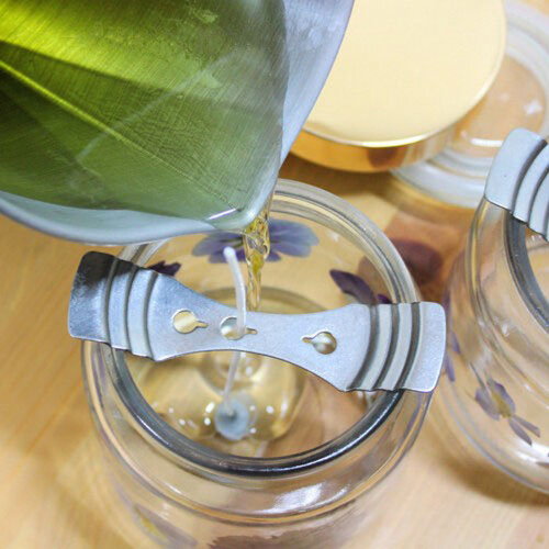 bow tie candle wick centering device